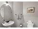 Bright powder room with pedestal sink and stylish accents at 2085 E 127Th Pl, Thornton, CO 80241