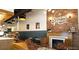 Cozy coffee shop featuring brick walls, comfortable seating, and a welcoming fireplace at 2085 E 127Th Pl, Thornton, CO 80241