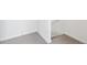 Carpeted basement area showcasing neutral flooring and access to the stairway at 6794 Merseyside Ln, Castle Pines, CO 80108