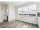 Bright dining area offering picturesque views, wood floors and neutral colors at 6794 Merseyside Ln, Castle Pines, CO 80108