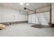 Spacious garage with concrete floors, a garage door, and an automatic opener at 6794 Merseyside Ln, Castle Pines, CO 80108