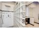 Modern bathroom with a spacious shower and elegant tile work at 9451 Desert Willow Trl, Highlands Ranch, CO 80129