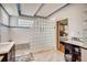 Modern bathroom with glass block shower and dual vanities at 9451 Desert Willow Trl, Highlands Ranch, CO 80129