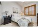 Cozy bedroom with natural light and comfortable furnishings at 9451 Desert Willow Trl, Highlands Ranch, CO 80129