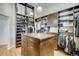 Spacious walk-in closet with custom organization and ample storage at 9451 Desert Willow Trl, Highlands Ranch, CO 80129