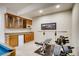 Home gym featuring a weight rack, weight bench and a custom dry bar with a mini fridge at 9451 Desert Willow Trl, Highlands Ranch, CO 80129