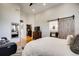 Well-lit main bedroom featuring an ensuite bathroom and walk-in closet at 9451 Desert Willow Trl, Highlands Ranch, CO 80129