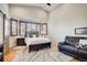 Spacious main bedroom with vaulted ceilings and a comfortable seating area at 9451 Desert Willow Trl, Highlands Ranch, CO 80129