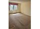 Bedroom with carpet and a window that provides natural light at 13601 E Marina Dr # 305, Aurora, CO 80014
