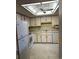 Bright kitchen featuring white appliances and cabinets at 13601 E Marina Dr # 305, Aurora, CO 80014