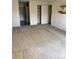 View of the living room showing carpeting and entrances to various rooms at 13601 E Marina Dr # 305, Aurora, CO 80014