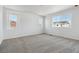 Spacious bedroom featuring large windows and neutral carpeting at 9672 Cathay St, Commerce City, CO 80022