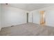 Bedroom featuring neutral carpeting and doorways at 9672 Cathay St, Commerce City, CO 80022