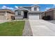 Charming two-story home featuring a two-car garage, well-manicured lawn, and inviting facade at 9672 Cathay St, Commerce City, CO 80022