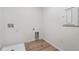 The laundry room features wood floors and appliances hookups at 9672 Cathay St, Commerce City, CO 80022