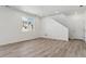 Bright living room featuring hardwood floors, recessed lighting, and a large window at 9672 Cathay St, Commerce City, CO 80022