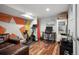 Finished basement with exercise bike, desk, and a unique wall decor at 6705 E Jewell Ave, Denver, CO 80224
