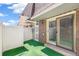 Enclosed back patio with privacy fence, brick siding, and convenient sliding door access at 1350 S Idalia St # G, Aurora, CO 80017