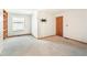 Spacious carpeted bedroom with a window, closet, and access to the en-suite bathroom at 1350 S Idalia St # G, Aurora, CO 80017