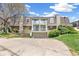 Inviting multi-story townhome featuring a two-car garage and a cozy balcony on a sunny day at 1350 S Idalia St # G, Aurora, CO 80017