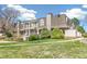 Exterior view of the condos featuring balconies, brick detailing, and a well-maintained lawn at 1350 S Idalia St # G, Aurora, CO 80017