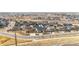 An aerial shot showcases this residential neighborhood in a warm, sunny location at 12551 Tamarac St, Thornton, CO 80602