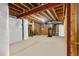 Unfinished basement with visible ceiling beams and mechanical systems at 12551 Tamarac St, Thornton, CO 80602