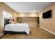 Basement bedroom with a queen bed and a flat-screen TV at 12551 Tamarac St, Thornton, CO 80602