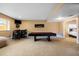 Finished basement with pool table and bar area at 12551 Tamarac St, Thornton, CO 80602