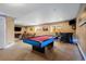 Finished basement with pool table and bar area at 12551 Tamarac St, Thornton, CO 80602