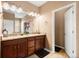 Bathroom with double vanity and granite countertops at 12551 Tamarac St, Thornton, CO 80602