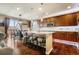 Gourmet kitchen featuring an island, breakfast bar, and plenty of counter space at 12551 Tamarac St, Thornton, CO 80602