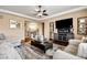 Comfortable living room featuring hardwood floors and a fireplace at 12551 Tamarac St, Thornton, CO 80602