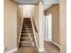 Upstairs hallway with carpeted floors and access to bedrooms at 12551 Tamarac St, Thornton, CO 80602