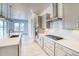 Modern kitchen featuring stainless steel appliances and a gas cooktop with barstool seating at 22097 E Rockinghorse Pkwy, Aurora, CO 80016