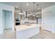 Spacious kitchen with modern appliances, a large island, and sleek gray cabinets at 22097 E Rockinghorse Pkwy, Aurora, CO 80016