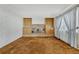 Gathering room with brick fireplace and built-in shelving at 16920 E Berry Ave, Centennial, CO 80015