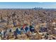 An aerial view of a neighborhood with a cityscape in the background, highlighting urban living at 3613 Julian St, Denver, CO 80211