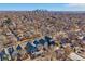 An aerial view of a neighborhood with a cityscape in the background, showcasing urban living at 3613 Julian St, Denver, CO 80211