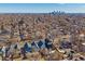 An aerial view of a neighborhood with a cityscape in the background, showcasing urban living at 3613 Julian St, Denver, CO 80211