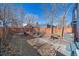 Private backyard featuring mature trees, a gazebo, a patio with dining table and an outdoor grill at 3613 Julian St, Denver, CO 80211