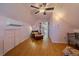 Bonus room with a leather chair, ceiling fan, and natural light from the windows at 3613 Julian St, Denver, CO 80211