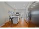 Bright kitchen with stainless steel appliances and white cabinets at 3613 Julian St, Denver, CO 80211