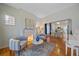 Bright living room with fireplace and hardwood floors at 3613 Julian St, Denver, CO 80211