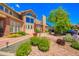 Beautiful home with manicured landscaping, mature trees, and a charming brick exterior at 4760 S Wadsworth Blvd # 302, Littleton, CO 80123