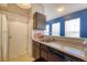 Functional kitchen with an eat-in bar, great countertops, and essential appliances at 4760 S Wadsworth Blvd # 302, Littleton, CO 80123