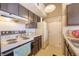 Functional kitchen with essential appliances, practical countertops, and ample cabinet storage at 4760 S Wadsworth Blvd # 302, Littleton, CO 80123