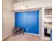 Inviting living area with vibrant blue wall and comfortable seating at 4760 S Wadsworth Blvd # 302, Littleton, CO 80123