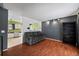 Living room with hardwood floors and view into the kitchen at 2402 S Lewiston St, Aurora, CO 80013