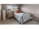 Bedroom with metal bed frame, neutral walls, and bright window at 11062 Gaylord St, Northglenn, CO 80233